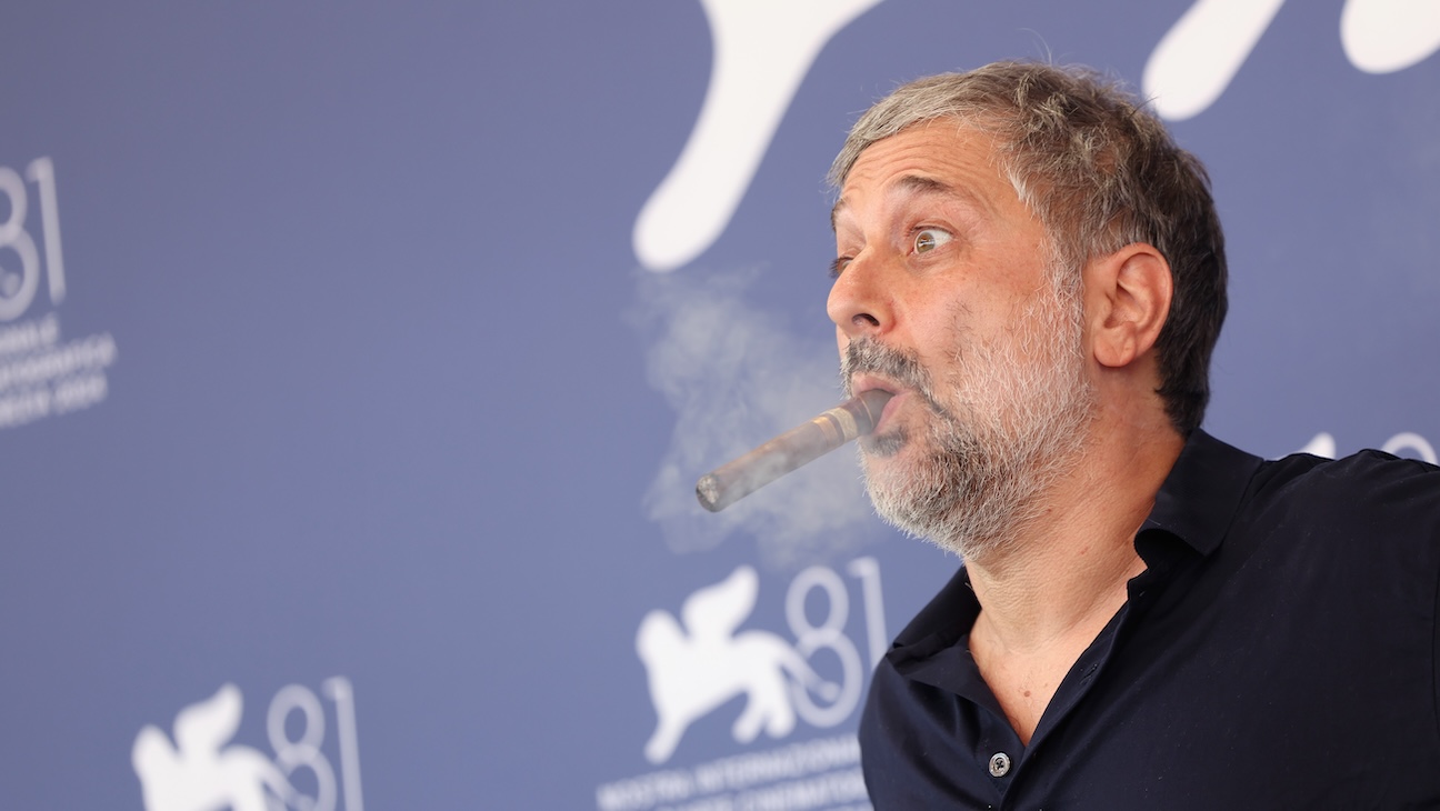 Harmony Korine Puffs Cigar, Talks Inspiration for First-Person Shooter Art Film ‘Baby Invasion’: “You’re Starting to See Hollywood Crumble Creatively”